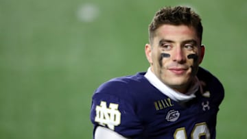 CHESTNUT HILL, MASSACHUSETTS - NOVEMBER 14: Ian Book #12 of the Notre Dame Fighting Irish looks on after the Fighting Irish defeat the Boston College Eagles 45-31 at Alumni Stadium on November 14, 2020 in Chestnut Hill, Massachusetts. (Photo by Maddie Meyer/Getty Images)