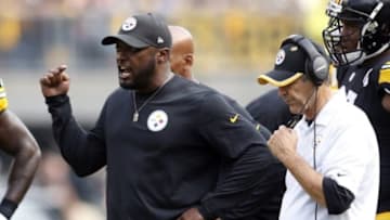Sep 28, 2014; Pittsburgh, PA, USA; Pittsburgh Steelers head coach Mike Tomlin (L) and defensive coordinator Dick LeBeau (R) react after a defensive stop against the Tampa Bay Buccaneers during the fourth quarter at Heinz Field. The Buccaneers won 27-24. Mandatory Credit: Charles LeClaire-USA TODAY Sports