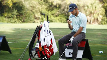 Mar 12, 2016; Palm Harbor, FL, USA; Matt Every looks at his smart phone on the driving range before teeing-off in the third round of the Valspar Championship at Innisbrook Resort - Copperhead Course. Mandatory Credit: Rob Schumacher-USA TODAY Sports