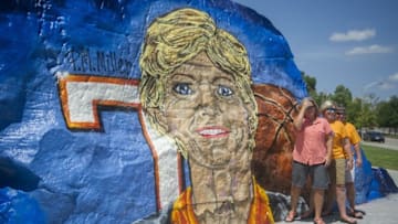 July 14, 2016; Knoxville, TN, USA; Allison Riddle , Rachel Shanks and Jan Bible , all of Greenville, N.C., pause for a photo in front of The Rock the Pat Summitt celebration of life ceremony at Thompson-Boiling Arena. Mandatory Credit: Caitie McMekin/Knoxville News Sentinel via USA TODAY NETWORK