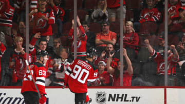 NEWARK, NEW JERSEY - SEPTEMBER 21: Jesper Boqvist #90 of the New Jersey Devils celebrates his second goal of the game which became the game winner at 15:57 of the third period on the powerplay against the New York Islanders at the Prudential Center on September 21, 2019 in Newark, New Jersey. The Devils defeated the Islanders 4-3. (Photo by Bruce Bennett/Getty Images)