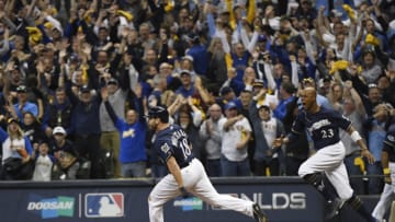 MILWAUKEE, WI - OCTOBER 04: Milwaukee Brewers third baseman Mike Moustakas (18) rounds first base after hitting a walk off single against Colorado Rockies pitcher Adam Ottavino (0) in the 10th inning at Miller Park to win the during the first game of the NLDS 3-2 October 04, 2018. (Photo by Andy Cross/The Denver Post via Getty Images)