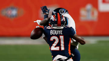 Sep 14, 2020; Denver, Colorado, USA; Denver Broncos cornerback A.J. Bouye (21) breaks up a pass intended for Tennessee Titans wide receiver A.J. Brown (11) in the first quarter at Empower Field at Mile High. Mandatory Credit: Isaiah J. Downing-USA TODAY Sports