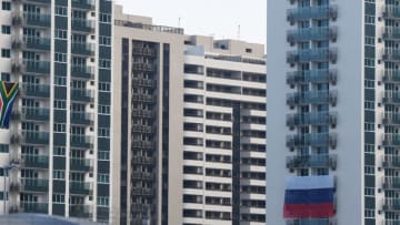 A Russian flag (R) is displayed at the Rio 2016 Olympic Village for Athletes, on July 25, 2016 in Rio de Janeiro.Russia breathed a sigh of relief after the IOC declined to impose a blanket ban on its competitors at the Rio Games over state-run doping, but the decision met fierce criticism elsewhere with Olympic chiefs branded 'spineless'. / AFP / VANDERLEI ALMEIDA (Photo credit should read VANDERLEI ALMEIDA/AFP/Getty Images)