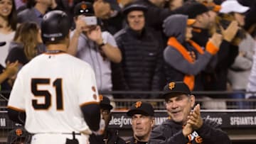 Jun 8, 2016; San Francisco, CA, USA; San Francisco Giants manager Bruce Bochy (15) claps in left fielder Mac Williamson (51) after Williamson