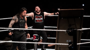 DUESSELDORF, GERMANY - FEBRUARY 22: Kevin Owens (R) is attacked by Roman Reigns (L) during to the WWE Live Duesseldorf event at ISS Dome on February 22, 2017 in Duesseldorf, Germany. (Photo by Lukas Schulze/Bongarts/Getty Images)