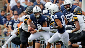 STATE COLLEGE, PA - SEPTEMBER 01: Trace McSorley #9 of the Penn State Nittany Lions looks to pass to Mac Hippenhammer #12 against MyQuon Stout #92 of the Appalachian State Mountaineers and Trey Cobb #45 of the Appalachian State Mountaineers on September 1, 2018 at Beaver Stadium in State College, Pennsylvania. (Photo by Justin K. Aller/Getty Images)