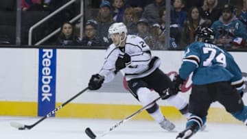 Jan 3, 2017; San Jose, CA, USA; Los Angeles Kings center Nic Dowd (26) controls the puck against San Jose Sharks defenseman Dylan DeMelo (74) during the first period at SAP Center at San Jose. Mandatory Credit: Neville E. Guard-USA TODAY Sports