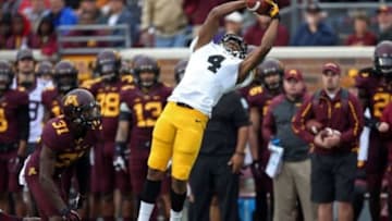Sep 28, 2013; Minneapolis, MN, USA; Iowa Hawkeyes wide receiver Tevaun Smith (4) catches a pass in the second quarter against the Minnesota Golden Gophers at TCF Bank Stadium. Mandatory Credit: Jesse Johnson-USA TODAY Sports