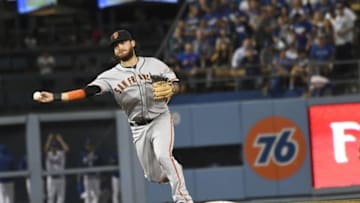 Aug 23, 2016; Los Angeles, CA, USA; San Francisco Giants shortstop Brandon Crawford (35) makes a throw to first base for an out during the bottom of third inning against the Los Angeles Dodgers at Dodger Stadium. Mandatory Credit: Richard Mackson-USA TODAY Sports