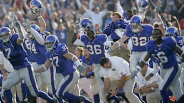 Members of the Kansas Jayhawks run onto the field after a game-winning field goal in overtime gave them a victory against the Iowa State Cyclones at Memorial Stadium in Lawrence, Kansas on November 26, 2005. Kansas won 24-21 in overtime. (Photo by G. N. Lowrance/Getty Images)