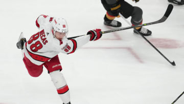 Mar 1, 2023; Las Vegas, Nevada, USA; Carolina Hurricanes center Martin Necas (88) scores on a shot against the Vegas Golden Knights during the second period at T-Mobile Arena. Mandatory Credit: Stephen R. Sylvanie-USA TODAY Sports
