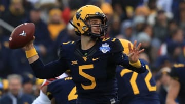 DALLAS, TX - DECEMBER 26: Chris Chugunov #5 of the West Virginia Mountaineers throws the ball against the Utah Utes in the second quarter during Zaxby's Heart of Dallas Bowl on December 26, 2017 at Cotton Bowl in Dallas, Texas. (Photo by Ronald Martinez/Getty Images)