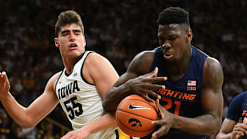 IOWA CITY. IA- FEBRUARY 02: Illinois center Kofi Cockburn (21) tries to handle the ball as Iowa forward Luka Garza (55) looks on during a Big Ten Conference basketball game between the Illinois Fighting Illini and the Iowa Hawkeyes at Carver-Hawkeye Arena, Iowa City Ia, on February 02, 2020. Photo by Keith Gillett/Icon Sportswire via Getty Images)