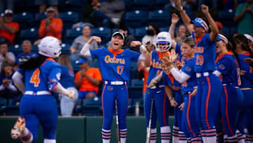 Florida third baseman Charla Echols (4) is greeted at home plate after hitting a solo home run in the bottom of the first. The Florida women’s softball team hosted Stetson at Katie Seashole Pressly Stadium in Gainesville, FL on Wednesday, March 29, 2023. Florida won 8-0 in six. [Doug Engle/Gainesville Sun]Flgai Stetson Uf Sb