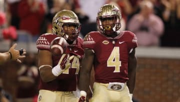 Oct 24, 2015; Atlanta, GA, USA; Florida State Seminoles running back Dalvin Cook (4) celebrates a touchdown run with running back DeMarcus Walker (44) against the Georgia Tech Yellow Jackets in the second quarter at Bobby Dodd Stadium. Mandatory Credit: Brett Davis-USA TODAY Sports