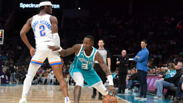 Hornets guard Terry Rozier (3) drives past OKC Thunder guard Shai Gilgeous-Alexander (2). Sam Sharpe-USA TODAY Sports
