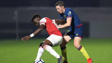 BOREHAMWOOD, ENGLAND - MARCH 29: Bukayo Saka of Arsenal is challenged by Conor Coventry of West Ham United during the Premier League 2 match between Arsenal and West Ham United at Meadow Park on March 29, 2019 in Borehamwood, England. (Photo by James Chance/Getty Images)