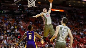 Nov 10, 2015; Miami, FL, USA; Miami Heat guard Tyler Johnson (8) attempts to dunk the ball over Los Angeles Lakers forward Nick Young (0) during the second half at American Airlines Arena. Mandatory Credit: Steve Mitchell-USA TODAY Sports