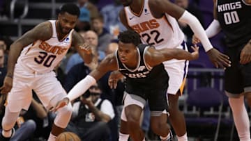 PHOENIX, ARIZONA - DECEMBER 04: Buddy Hield #24 of the Sacramento Kings attempts to control the ball against Troy Daniels #30 of the Phoenix Suns during the first half of the NBA game at Talking Stick Resort Arena on December 4, 2018 in Phoenix, Arizona. NOTE TO USER: User expressly acknowledges and agrees that, by downloading and or using this photograph, User is consenting to the terms and conditions of the Getty Images License Agreement. (Photo by Christian Petersen/Getty Images)
