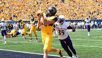 MORGANTOWN, WV - SEPTEMBER 09: David Sills V #13 of the West Virginia Mountaineers makes a touchdown catch in front of Chris Love #35 of the East Carolina Pirates during the second quarter at Mountaineer Field on September 9, 2017 in Morgantown, West Virginia. (Photo by Joe Sargent/Getty Images)