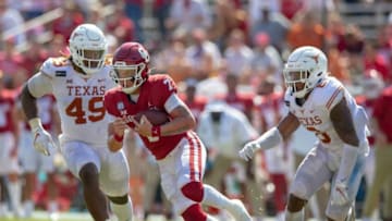 Auburn footballOU quarterback Spencer Rattler (7) looks for room to run against Texas defensive lineman Ta'Quon Graham (49) and defensive back D'Shawn Jamison (5) last season at the Cotton Bowl in Dallas.Texas Vs Ou