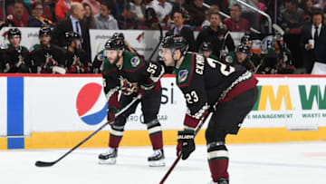 GLENDALE, AZ - OCTOBER 13: Oliver Ekman-Larsson #23 and Jason Demers #55 of the Arizona Coyotes get ready during a faceoff against the Buffalo Sabres at Gila River Arena on October 13, 2018 in Glendale, Arizona. (Photo by Norm Hall/NHLI via Getty Images)