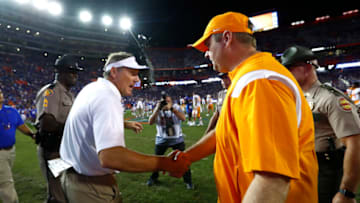Sep 25, 2021; Gainesville, Florida, USA; Florida Gators head coach Dan Mullen and Tennessee Volunteers head coach Josh Heupel greet after the game at Ben Hill Griffin Stadium. Mandatory Credit: Kim Klement-USA TODAY Sports