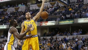 Dec 8, 2015; Indianapolis, IN, USA; Golden State Warriors center Andrew Bogut (12) dunks against Indiana Pacers center Ian Mahinmi (28) at Bankers Life Fieldhouse. Golden State defeats Indiana 131-123. Mandatory Credit: Brian Spurlock-USA TODAY Sports