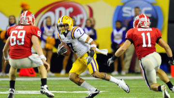 Dec 3, 2011; Atlanta, GA, USA; LSU Tigers cornerback Tyrann Mathieu (7) returns a punt during the second half of the 2011 SEC championship game against the Georgia Bulldogs at the Georgia Dome. Mandatory Credit: Dale Zanine-USA TODAY Sports