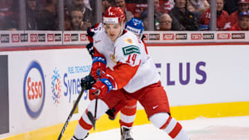 VANCOUVER, BC - DECEMBER 28: Vitali Kravtsov #14 of Russia fights off the check of Matej Pekar #5 of the Czech Republic in Group A hockey action of the 2019 IIHF World Junior Championship action on December, 28, 2018 at Rogers Arena in Vancouver, British Columbia, Canada. (Photo by Rich Lam/Getty Images)