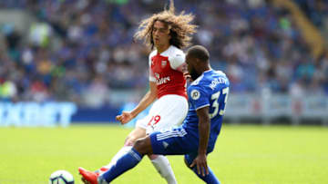 CARDIFF, WALES - SEPTEMBER 02: Matteo Guendouzi of Arsenal is faced by Junior Hoilett of Cardiff City during the Premier League match between Cardiff City and Arsenal FC at Cardiff City Stadium on September 2, 2018 in Cardiff, United Kingdom. (Photo by Clive Rose/Getty Images)