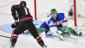 HALIFAX, CANADA - JANUARY 02: Connor Bedard #16 of Team Canada skates the puck towards goaltender Adam Gajan #30 of Team Slovakia during overtime in the quarterfinals of the 2023 IIHF World Junior Championship at Scotiabank Centre on January 2, 2023 in Halifax, Nova Scotia, Canada. Team Canada defeated Team Slovakia 4-3. (Photo by Minas Panagiotakis/Getty Images)