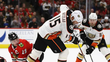 CHICAGO, IL - OCTOBER 23: Jonathan Toews #19 of the Chicago Blackhawks gets tangled up with Ryan Getzlaf #15 of the Anaheim Ducks at the United Center on October23, 2018 in Chicago, Illinois. The Blackhawks defeated the Ducks 3-1. (Photo by Jonathan Daniel/Getty Images)