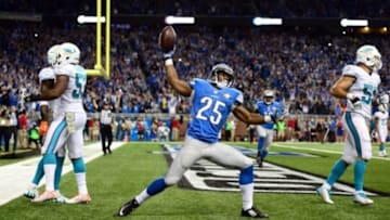 Nov 9, 2014; Detroit, MI, USA; Detroit Lions running back Theo Riddick (25) celebrates after catching a pass in the end zone for a touchdown during the fourth quarter against the Miami Dolphins at Ford Field. Mandatory Credit: Andrew Weber-USA TODAY Sports