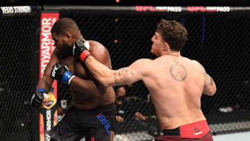 ABU DHABI, UNITED ARAB EMIRATES - OCTOBER 11: In this handout image provided by UFC, (R-L) Tom Aspinall of England punches Alan Baudot of France in their heavyweight bout during the UFC Fight Night event inside Flash Forum on UFC Fight Island on October 11, 2020 in Yas Island, Abu Dhabi, United Arab Emirates. (Photo by Josh Hedges/Zuffa LLC via Getty Images)
