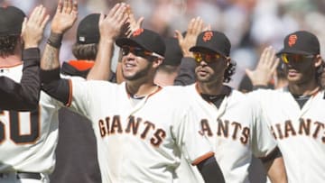 Jul 9, 2016; San Francisco, CA, USA; San Francisco Giants left fielder Angel Pagan (16), shortstop Brandon Crawford (35), and Gregor Blanco (7) celebrates with teammates after defeating the Arizona Diamondbacks 4-2 at AT&T Park. Mandatory Credit: Neville E. Guard-USA TODAY Sports