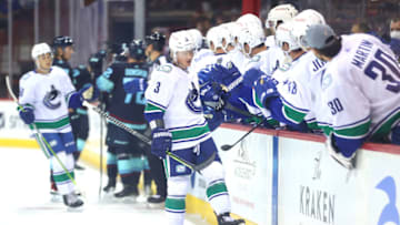 SPOKANE, WASHINGTON - SEPTEMBER 26: Jack Rathbone #3 of the Vancouver Canucks celebrates his goal in the first period to take a 1-0 lead against the Seattle Kraken during a preseason game at Spokane Veterans Memorial Arena on September 26, 2021 in Spokane, Washington. (Photo by Abbie Parr/Getty Images)