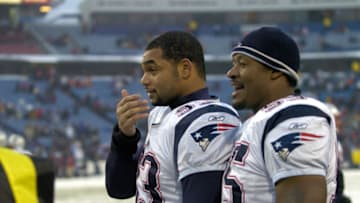 New England Patriots defenders Richard Seymour (93) and Willie McGinest (55) celebrate their victory late in the game against the Buffalo Bills at Ralph Wilson Stadium in Orchard Park, New York on December 11, 2005. New England won the game 35-7. (Photo by Mark Konezny/NFLPhotoLibrary)