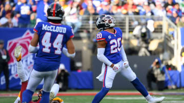Dec 4, 2022; East Rutherford, New Jersey, USA; New York Giants safety Julian Love (20) reacts to a defensive play against the Washington Commanders during the first half at MetLife Stadium. Mandatory Credit: Rich Barnes-USA TODAY Sports