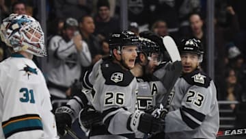 Dec 31, 2016; Los Angeles, CA, USA; Los Angeles Kings defenseman Drew Doughty (8) celebrates with center Nic Dowd (26) and right wing Dustin Brown (23) after scoring a goal in the second period as San Jose Sharks goalie Martin Jones (31) reacts during a NHL hockey match at Staples Center. Mandatory Credit: Kirby Lee-USA TODAY Sports