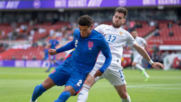 MIDDLESBROUGH, ENGLAND - JUNE 06: Ben Godfrey of England and Georgian Paun of Romania in action during the international friendly match between England and Romania at Riverside Stadium on June 6, 2021 in Middlesbrough, United Kingdom. (Photo by Visionhaus/Getty Images)