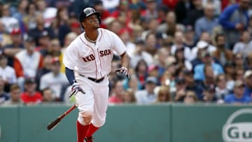 May 22, 2016; Boston, MA, USA; Boston Red Sox shortstop Xander Bogaerts (2) hits a single during the sixth inning against the Cleveland Indians at Fenway Park. Mandatory Credit: Greg M. Cooper-USA TODAY Sports