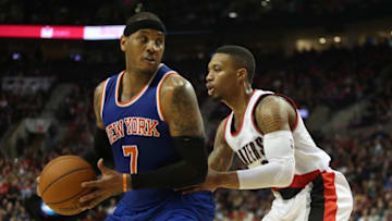 Dec 12, 2015; Portland, OR, USA; Portland Trail Blazers guard Damian Lillard (0) defends New York Knicks forward Carmelo Anthony (7) at Moda Center at the Rose Quarter. Mandatory Credit: Jaime Valdez-USA TODAY Sports