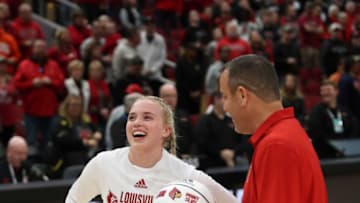 Louisville’s Hailey Van Lith is given her 1,000 point ball from coach Jeff Walz.Dec. 29, 2022Louisvillesyrcause 21