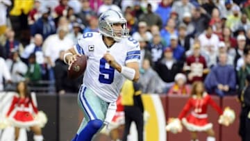 Dec 8, 2013; Landover, MD, USA; Dallas Cowboys quarterback Tony Romo (9) scrambles against the Washington Redskins during the second half at FedEx Field. Mandatory Credit: Brad Mills-USA TODAY Sports