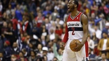 Mar 15, 2014; Washington, DC, USA; Washington Wizards guard John Wall (2) celebrates in the final seconds of the fourth quarter against the Brooklyn Nets at Verizon Center. The Wizards won 101-94. Mandatory Credit: Geoff Burke-USA TODAY Sports