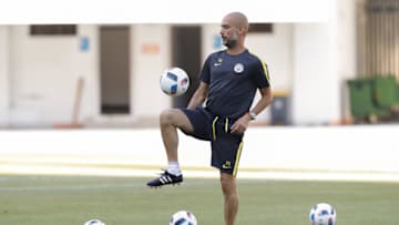 SHENZHEN, CHINA - JULY 27: Manchester City's manager Pep Guardiola plays with the ball during the pre-game training ahead of the 2016 International Champions Cup match between Manchester City and Borussia Dortmund at Shenzhen Stadium on July 27, 2016 in Shenzhen, China. (Photo by Lintao Zhang/Getty Images)