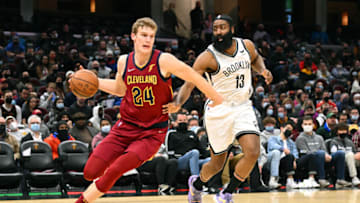 CLEVELAND, OHIO - JANUARY 17: Lauri Markkanen #24 of the Cleveland Cavaliers drives to the basket around James Harden #13 of the Brooklyn Nets during the third quarter at Rocket Mortgage Fieldhouse on January 17, 2022 in Cleveland, Ohio. The Cavaliers defeated the Nets 114-107. NOTE TO USER: User expressly acknowledges and agrees that, by downloading and/or using this photograph, user is consenting to the terms and conditions of the Getty Images License Agreement. (Photo by Jason Miller/Getty Images)