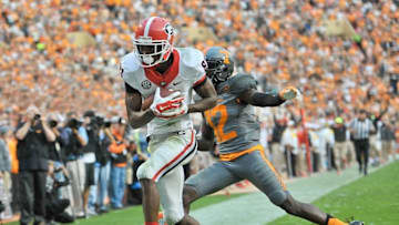 Oct 10, 2015; Knoxville, TN, USA; Georgia Bulldogs wide receiver Reggie Davis (81) rushes for a touchdown against Tennessee Volunteers defensive back Emmanuel Moseley (12) during the second half at Neyland Stadium. Tennessee won 38-31. Mandatory Credit: Jim Brown-USA TODAY Sports